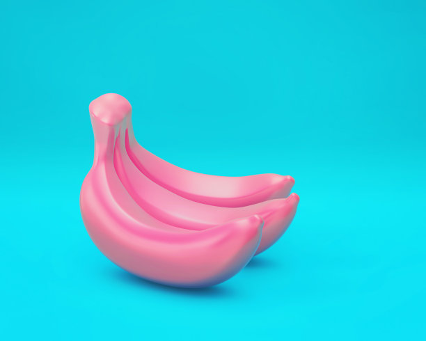 蓝色背景上的三根粉色香蕉图片下载