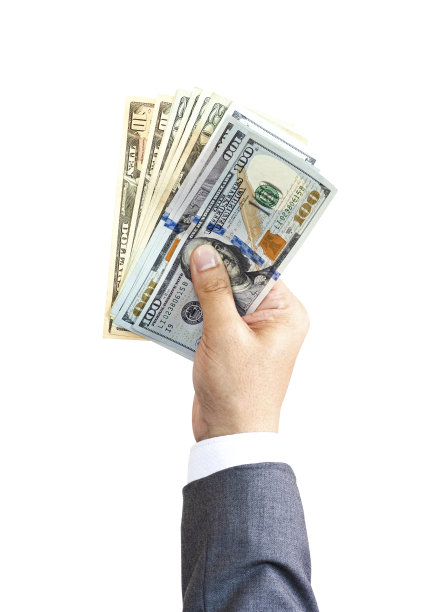商人拿着美元钞票在白色背景上付款。美元是世界上最主要、最流行的兑换货币。投资和支付概念。图片下载
