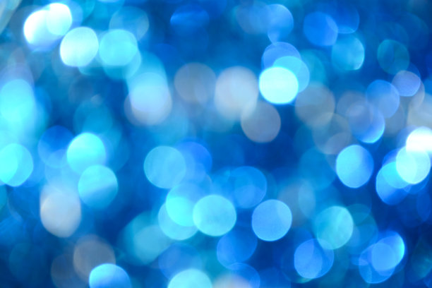 散景照片。节日的背景。圣诞灯。背景。散焦蓝宝石。新年的背景。节日的壁纸。眨眼。狂欢节。复古风格的照片。蓝色的。图片下载