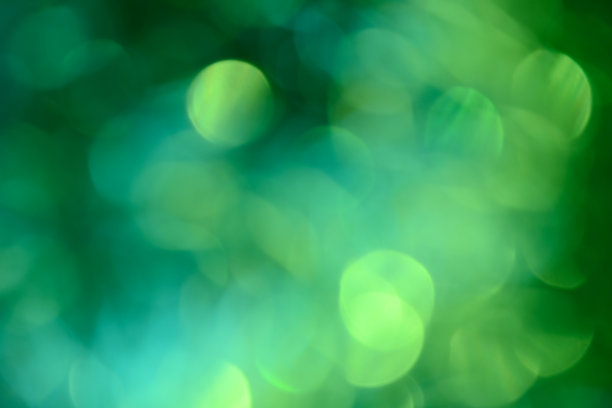 散景。节日的背景。圣诞灯。闪闪发光。散焦蓝宝石。新年的背景。节日的壁纸。眨眼。狂欢节。金属丝。散景复古风格照片。绿色的。图片下载