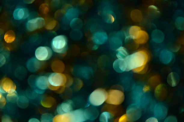 散景。节日的背景。圣诞灯。闪闪发光。散焦蓝宝石。新年的背景。节日的壁纸。眨眼。狂欢节。金属丝。散景复古风格照片。金。黄金。图片下载