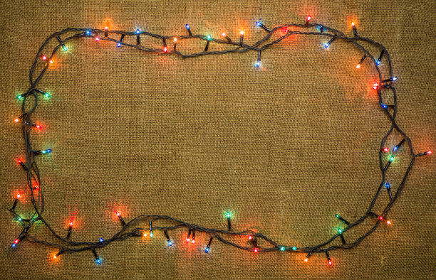 发光的灯为圣诞假期圆形纺织背景图片下载