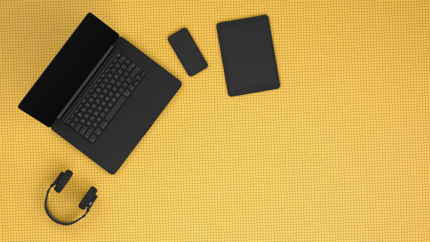 黄色网格工作场所的黑色笔记本电脑，技术理念概念图片下载