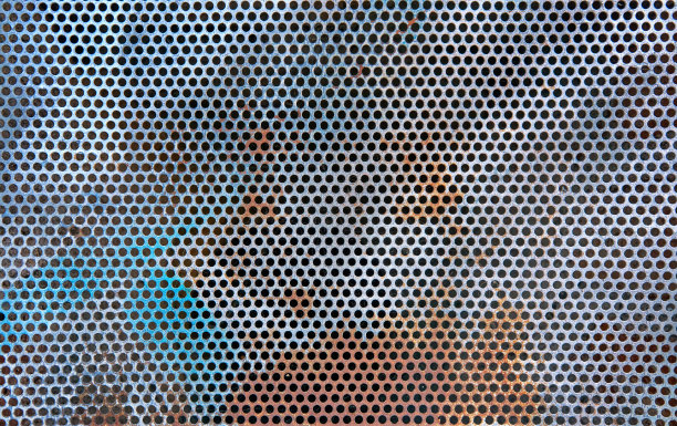 穿孔金属板作为背景。清洁对抗肮脏的立面符号。图片下载