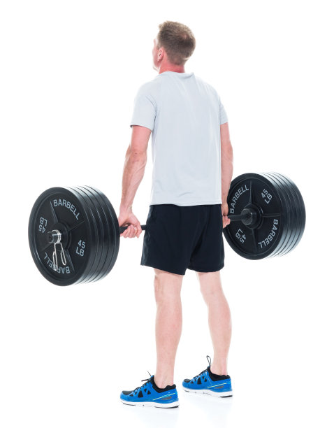 全身/一人/一人/后视图20-29岁英俊的人棕色头发/短发白人男性/年轻男子运动员/运动员运动/站在白人背景/重图片下载