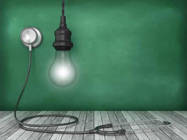 听诊器与灯泡在黑板背景- 3D渲染图片下载