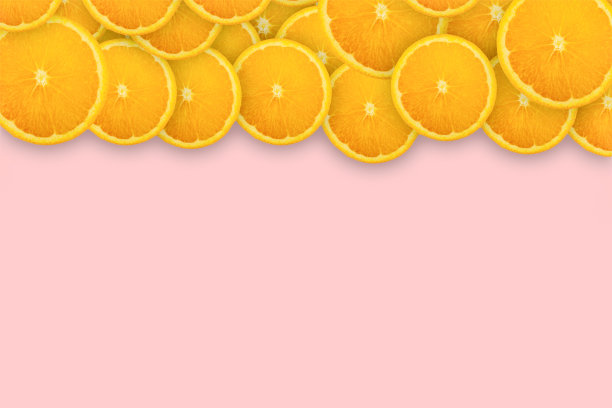 粉红色背景上的橘片。背景与模式概念图片下载