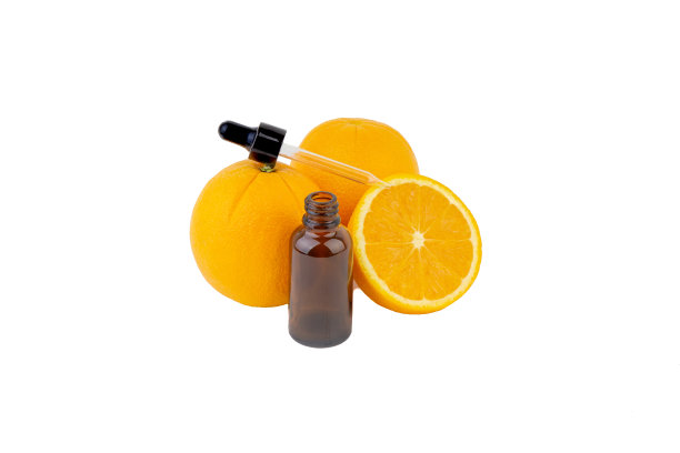 维生素C血清瓶与滴管和橙色的白色背景。图片下载