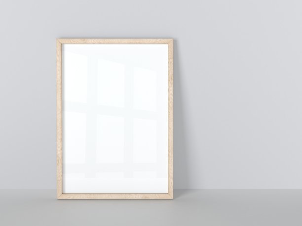 木框架孤立在灰色的墙上。图片下载