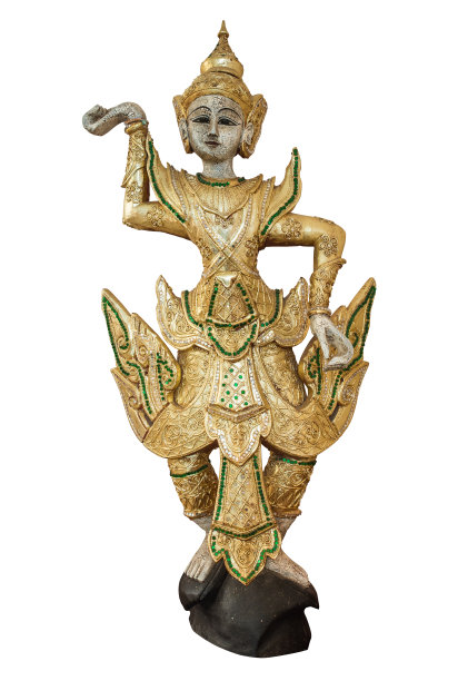 传统的舞蹈娃娃穿着金色的服饰和头饰作为孤立的画面图片下载