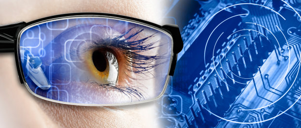 一个年轻女性的宏观视角与眼镜和技术背景图片下载