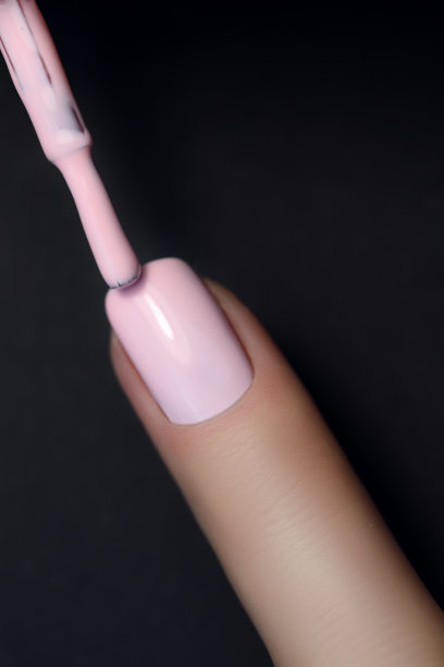 指甲点孤立的背景与指甲油。画指甲。图片下载