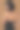 苗条的女孩在米色背景的黑色连衣裙图片下载