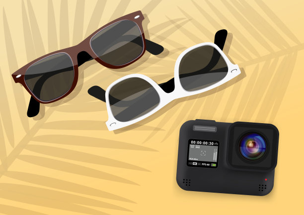 海滩上的太阳镜和动作摄影机图片下载