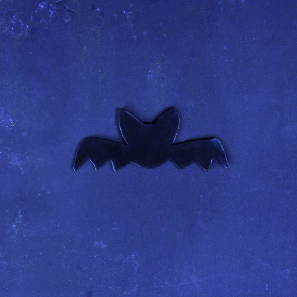 万圣节的概念。黑暗背景上蝙蝠的剪影。假期最少的设计。图片下载