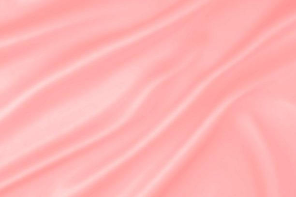 粉红色软缎皱丝抽象背景与柔软的波浪。艺术红粉色柔软的丝绸织物光滑的波浪背景。图片下载