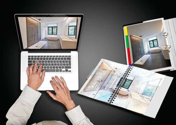 一个穿着白衬衫在笔记本电脑前工作的商人图片下载