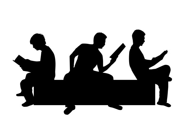 一个拿着书的男人的剪影。图片下载