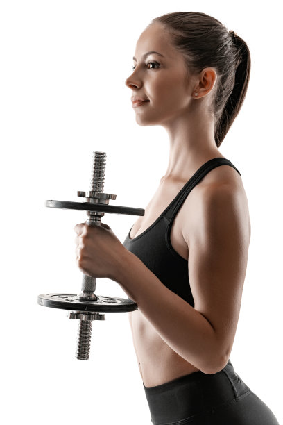 深色头发的女人在黑色的打底裤，上衣和运动鞋摆出孤立的白色。健身、健身、健康生活理念图片下载