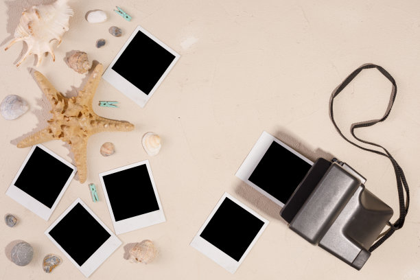 纹理背景上的空照片和相机。保存记忆的概念。海星和贝壳。图片下载