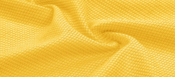 背景纹理，图案织物温暖的羊毛与一针黄色线。展示你真正的条纹与我们的黄色羊毛针织。拥有明亮，折衷的颜色，散发出波西米亚的外观。图片下载