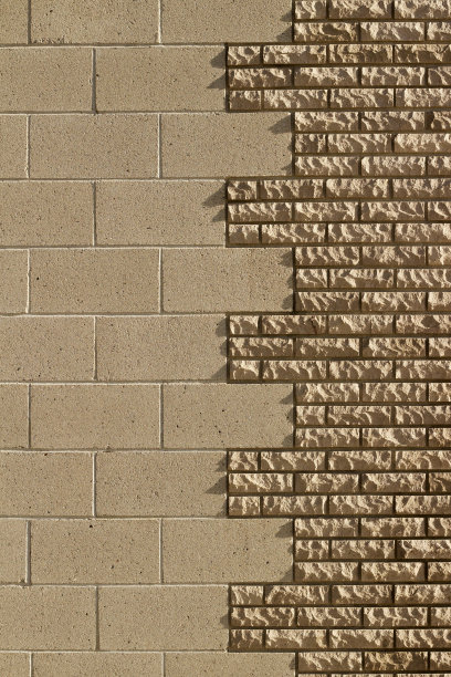 浅棕色组合纹理砖和混凝土砌块石材墙背景图片下载
