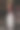 酒瓶烛台上覆盖着蜡，烛台上点燃的蜡烛，坐在吧台上映着镜子图片下载