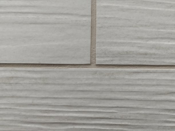 灰色的瓷砖和接缝。抽象的背景纹理。图片下载