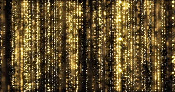 金色的细雨，金色的颗粒在黑色的背景上丝线窗帘。奢华的金色闪烁灯与散景火花闪烁图片下载