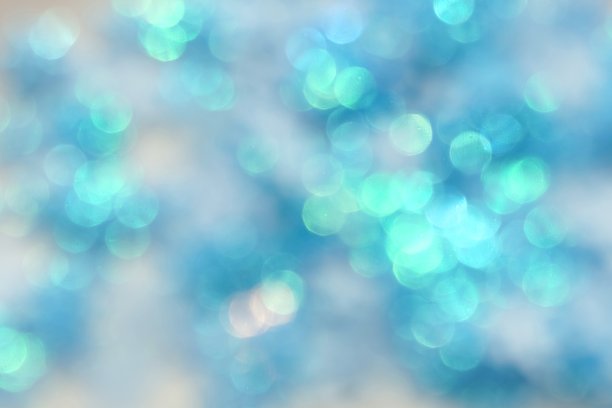 模糊闪光，散焦，散焦蓝色节日背景，纹理。圣诞节的抽象背景。图片下载