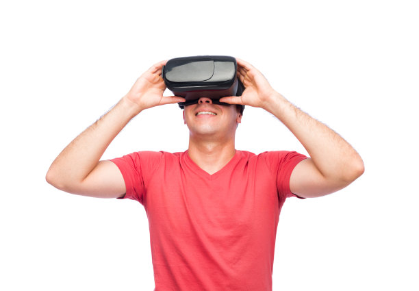 一个戴着虚拟现实眼镜的兴奋的年轻人图片下载