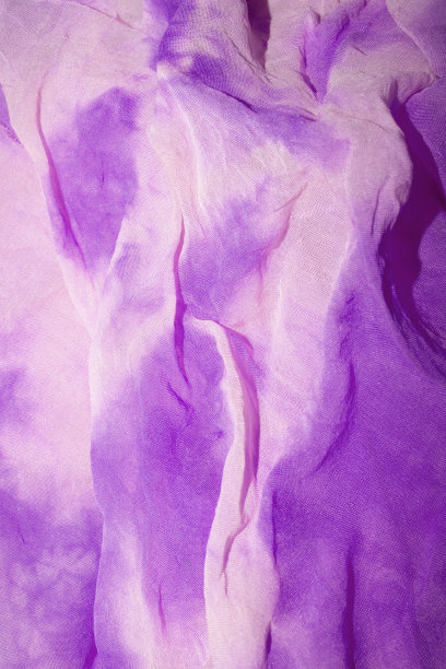 扎染织物上的丝绸时髦的颜色皱边图片下载