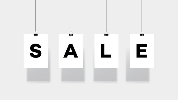 挂在回形针上的纸。销售文本设计图片下载