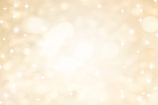 抽象模糊美丽的柔和明亮的金属金色背景与圆形散景灯和闪亮的星星为圣诞节日和新年快乐季系列设计的旗帜概念图片下载