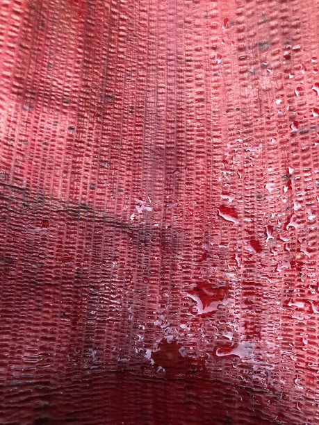 抽象的红色背景纹理与水滴图片下载