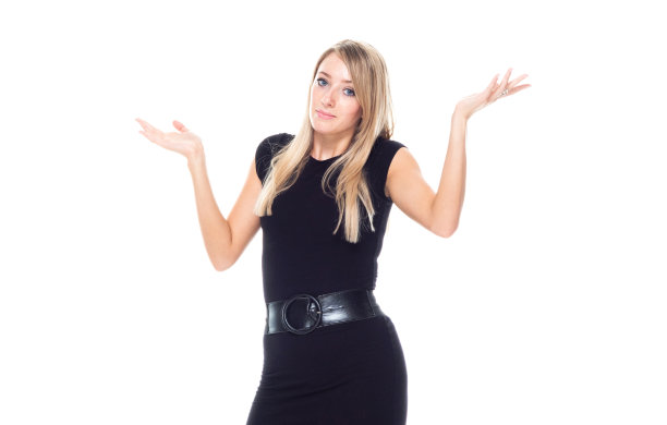 正面视图/一人/腰部以上20-29岁的成年人漂亮的金发/长发白种人女性/年轻女性商人/商人站着穿着商务装/连衣裙/套装谁是困惑/不确定图片下载