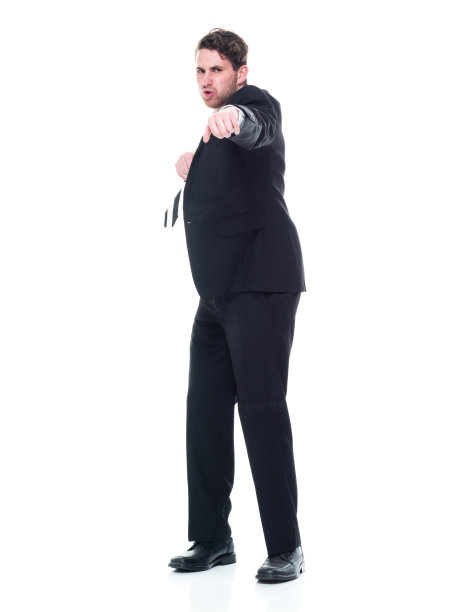 全长/一人/正面的观点20-29岁的成年美丽的高加索年轻女性/女经理/商人/商人站在白色的背景谁是严肃和显示拳头图片下载