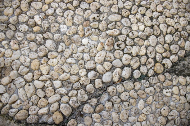 鹅卵石铺装的照片纹理。细小的大理石砾石路。卵石纹理。海洋或海边的建筑材料。图片下载