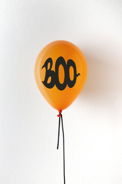 白色背景上黑色文字的橙色假日气球图片下载