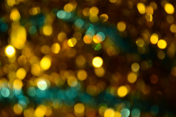 散景。节日的背景。圣诞灯。闪闪发光。散焦蓝宝石。新年的背景。节日的壁纸。眨眼。狂欢节。金属丝。散景复古风格照片。金。黄金。图片下载