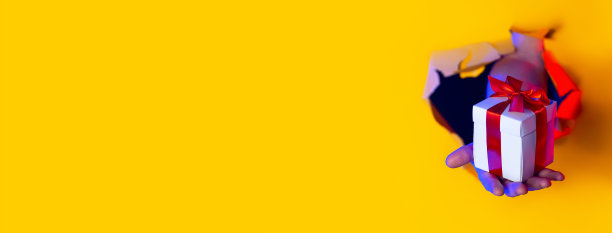 在霓虹灯的照射下，黄色的纸背景上一个破洞里出现了一件拿着红色蝴蝶结的礼物图片下载