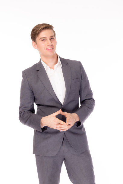 肖像迷人英俊的年轻商人。帅气帅气的帅哥穿正式装或灰色西装、衬衫。魅力男人，英俊的男人。年轻人得到放松，快乐地在白色背景下独处图片下载