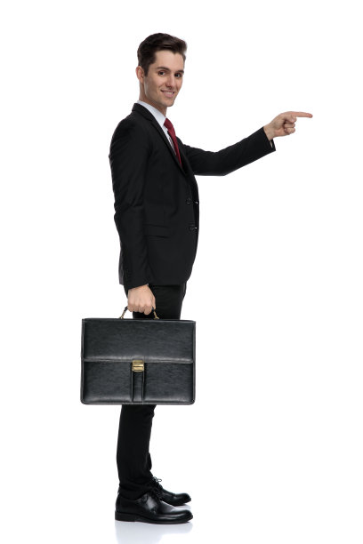 侧视图，一个商人指着并拿着一个公文包图片下载