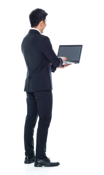 向下看/后视图/全身/一人/一人20-29岁的成年人英俊的人中国民族/东亚民族男性/年轻男子商人/商人站在白色背景穿着西装图片下载