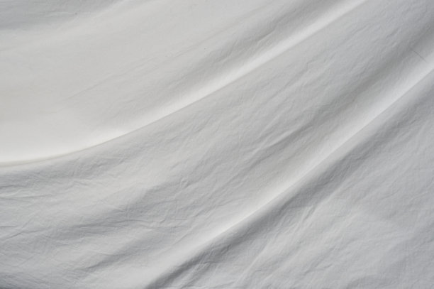 细布背景的柔软褶皱图片下载