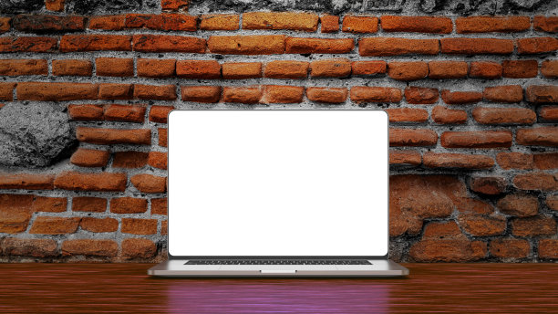 笔记本电脑放在木桌上。模板、模型、设计。图片下载