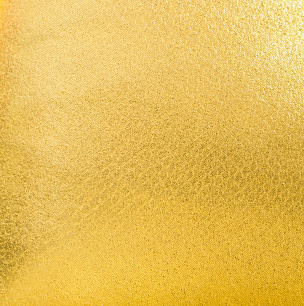 金光闪闪的金黄色织物质地。表面，图案粗糙抽象布亚光背景。在您的作品中设计装饰背景，概念文字复制空间。图片下载