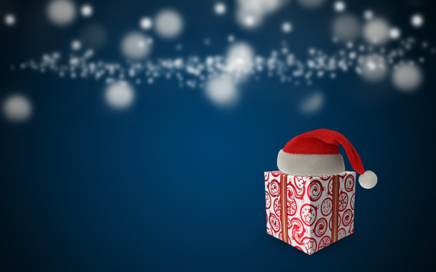 圣诞贺卡与圣诞老人的帽子和礼物盒在蓝色的背景图片下载