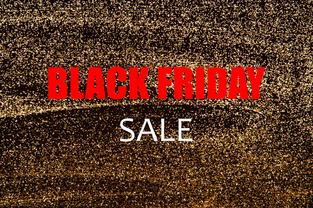 黑色星期五的促销，金色的闪闪发光的背景图片下载