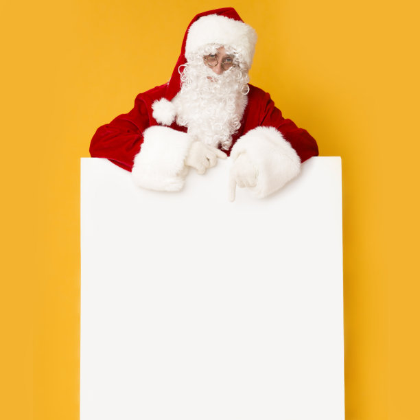 圣诞老人与大的白色宣传海报在明亮的橙色图片下载